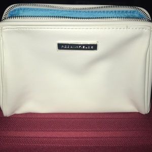 NEW Rodan + Fields beautiful make-up bag with bright blue interior.
